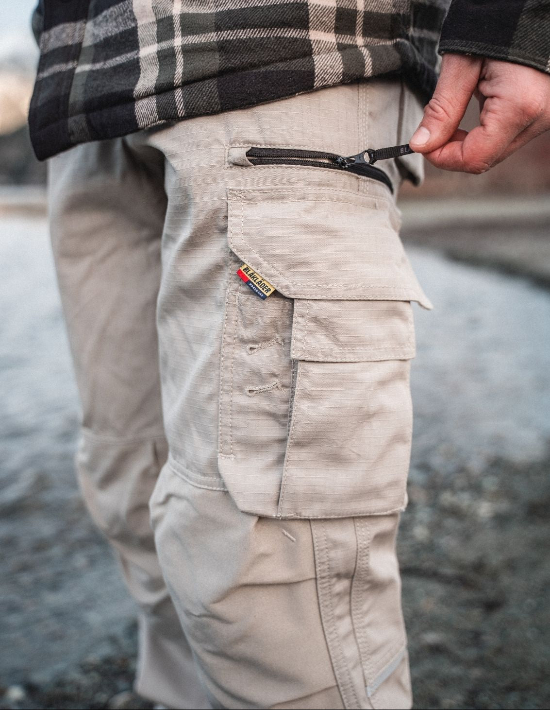 Blaklader Ripstop Pants in Stone with zippered cargo pocket detail for tradespeople on job site
